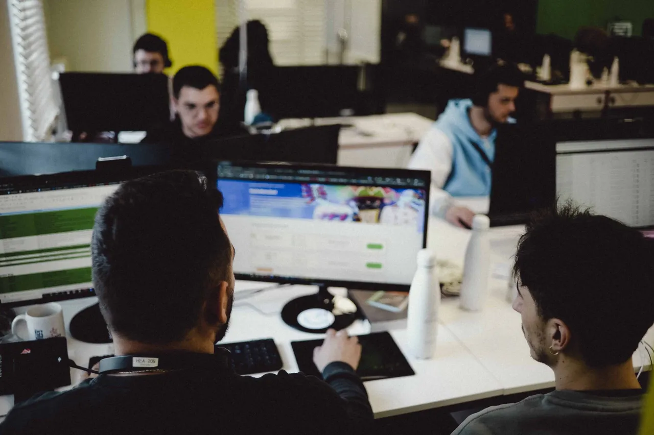 StarLabs engineers at work at their desks in the open-plan office